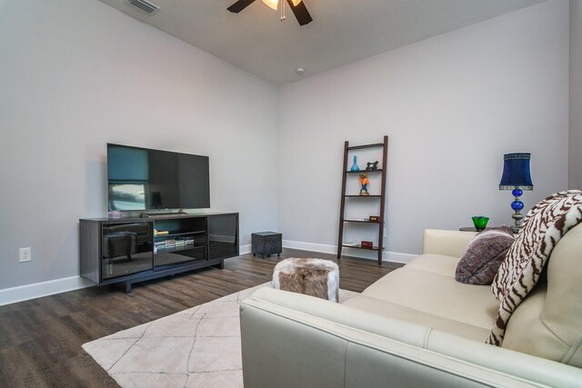 living room with ceiling fan, lofted ceiling, and dark hardwood / wood-style floors