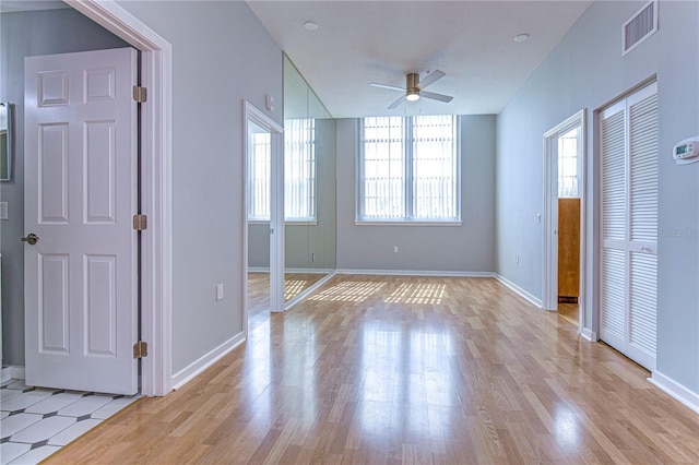 701 Mirror Lake Dr N Unit 309, Saint Petersburg, FL 33701 - unfurnished bedroom with light wood-type flooring, visible vents, and baseboards