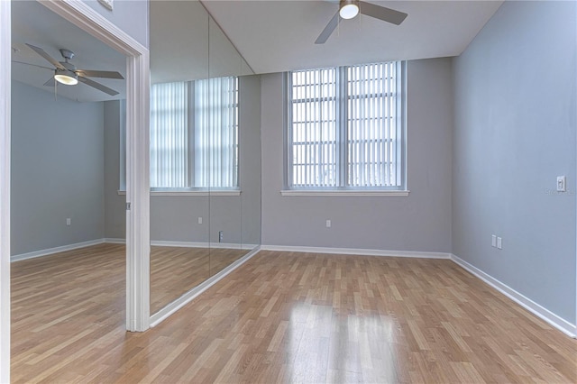 spare room featuring light wood-type flooring and ceiling fan