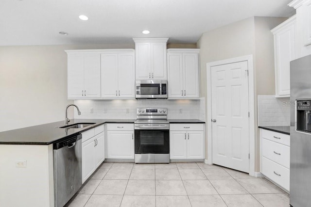 kitchen with sink, white cabinets, and stainless steel appliances