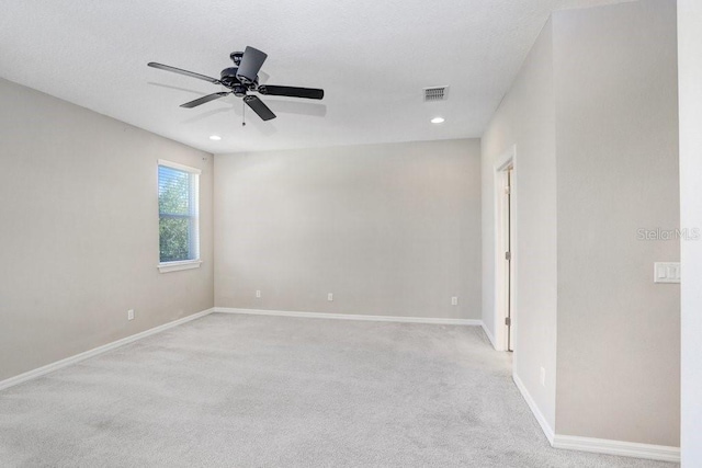 carpeted empty room with ceiling fan