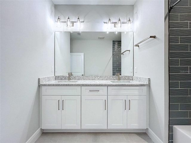 bathroom with tile patterned flooring and vanity