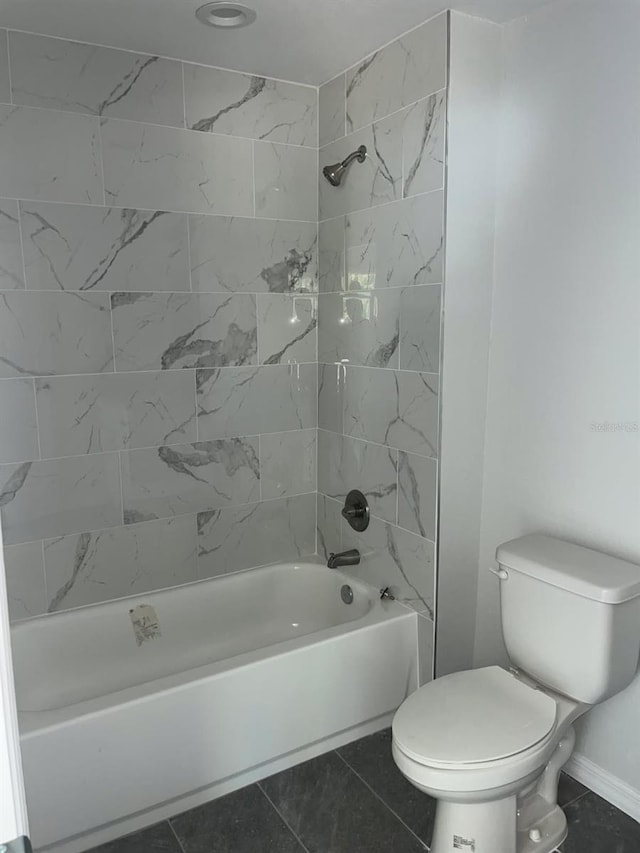 1740 Magnolia Ave, Bartow, FL 33830 - bathroom with toilet, tiled shower / bath combo, and tile patterned flooring