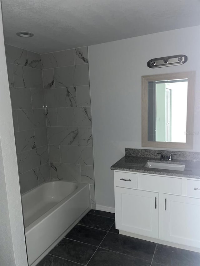 1740 Magnolia Ave, Bartow, FL 33830 - bathroom with vanity, tiled shower / bath combo, and tile patterned flooring