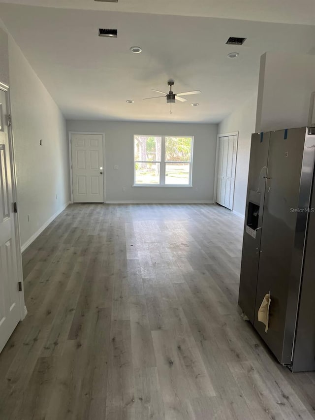1740 Magnolia Ave, Bartow, FL 33830 - unfurnished living room with light hardwood / wood-style flooring and ceiling fan