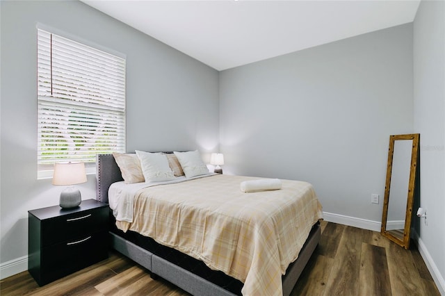 bedroom featuring dark hardwood / wood-style floors