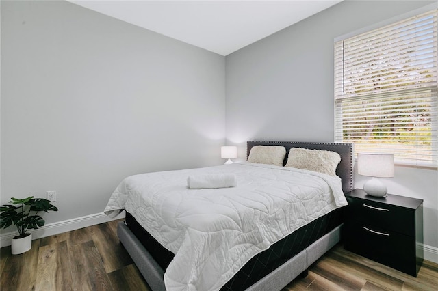 bedroom featuring dark wood-type flooring