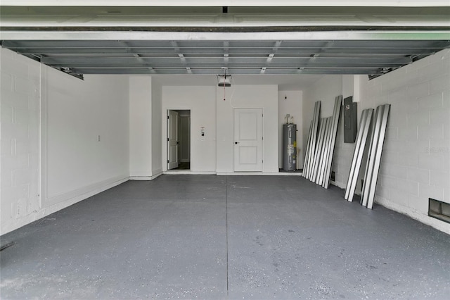 garage with a garage door opener, electric water heater, and electric panel