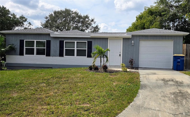 ranch-style home with a front lawn and a garage