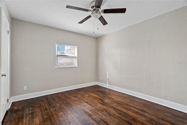 empty room featuring ceiling fan, a textured ceiling, and dark hardwood / wood-style floors