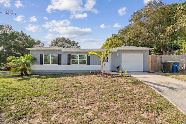 ranch-style home with a front yard and a garage