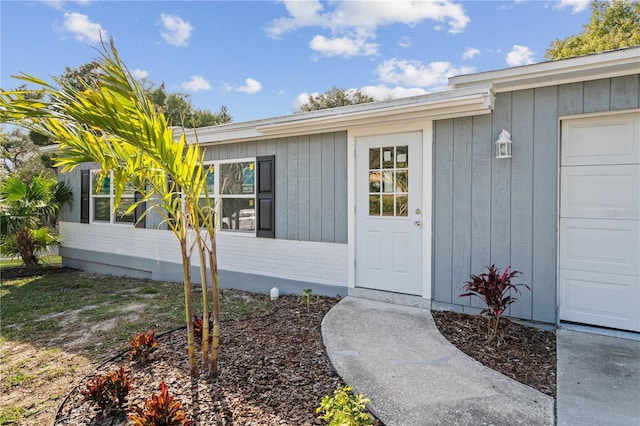 doorway to property featuring a garage