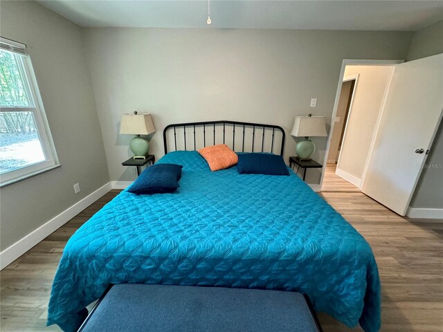 bedroom featuring hardwood / wood-style flooring