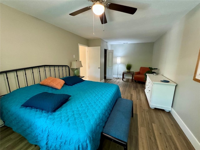 bedroom with hardwood / wood-style flooring and ceiling fan