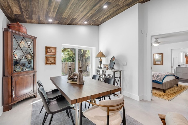 dining space featuring wood ceiling, high vaulted ceiling, and ceiling fan