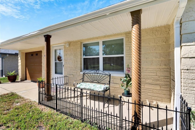 exterior space featuring brick siding, concrete driveway, a garage, and fence