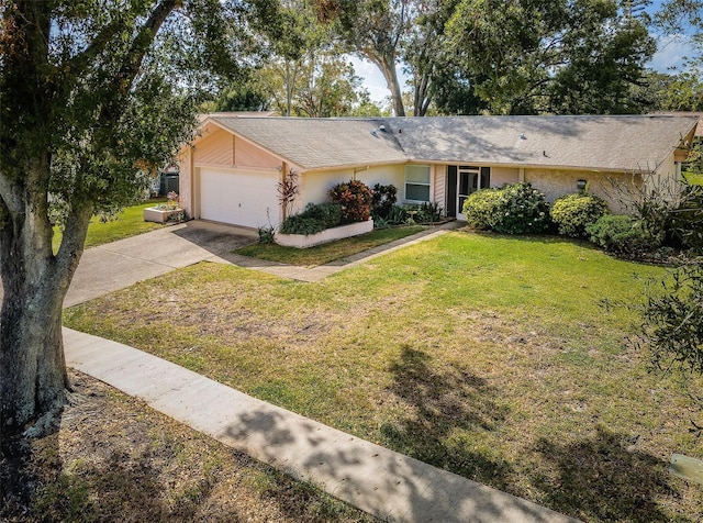 ranch-style house featuring a front yard, an attached garage, concrete driveway, and stucco siding