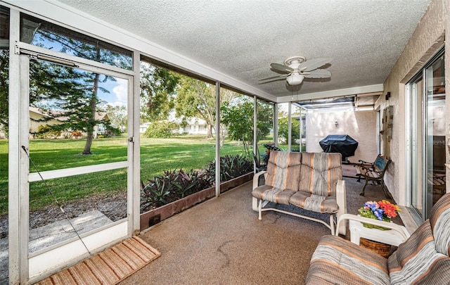 sunroom with a healthy amount of sunlight and a ceiling fan