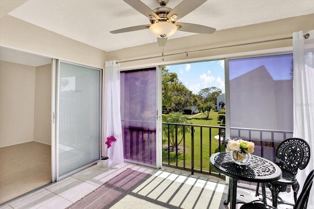 sunroom / solarium with ceiling fan