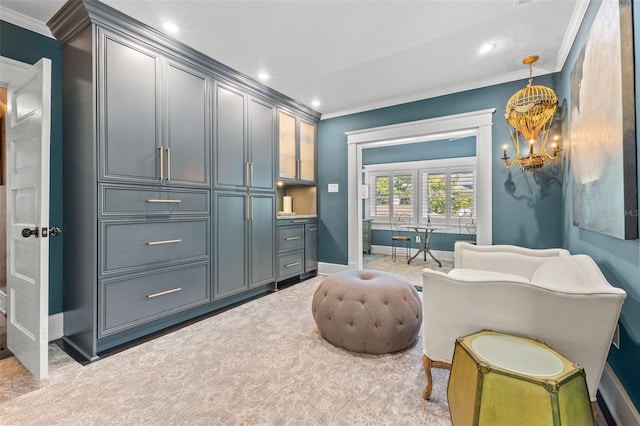 sitting room featuring ornamental molding and light colored carpet