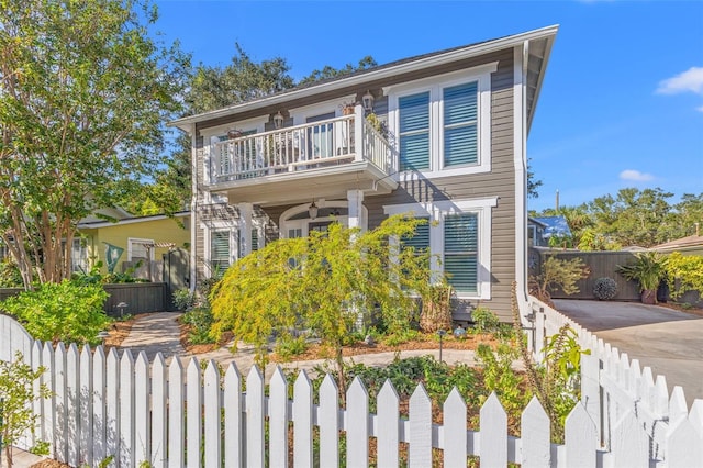 view of front of property with a balcony