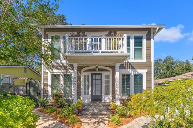 view of front of house featuring a balcony