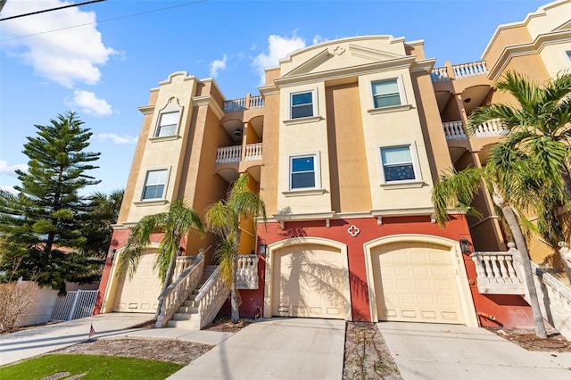 townhome / multi-family property with a garage and a balcony