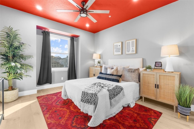 bedroom with light wood-type flooring and ceiling fan