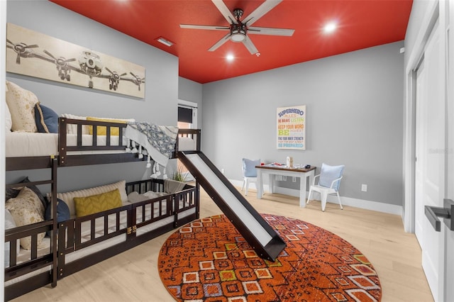 bedroom with hardwood / wood-style floors and ceiling fan