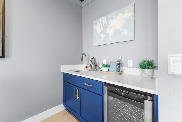 interior space featuring vanity, wine cooler, and hardwood / wood-style flooring