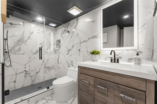 bathroom with tile walls, vanity, toilet, and an enclosed shower