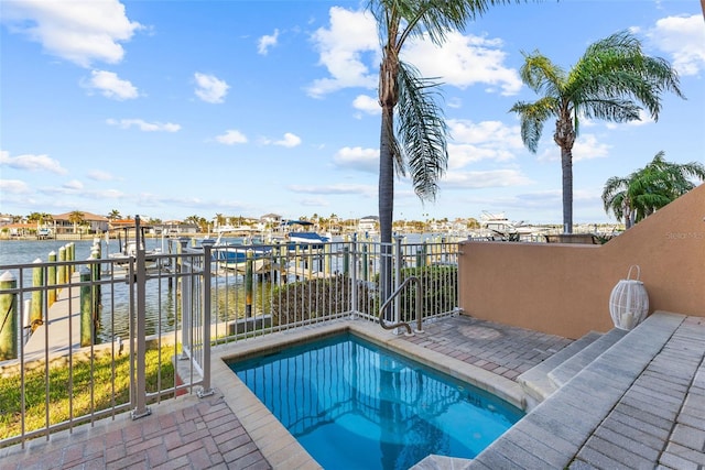 view of pool with a water view