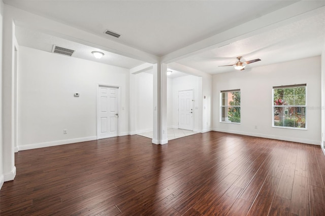 spare room featuring ceiling fan and dark hardwood / wood-style floors