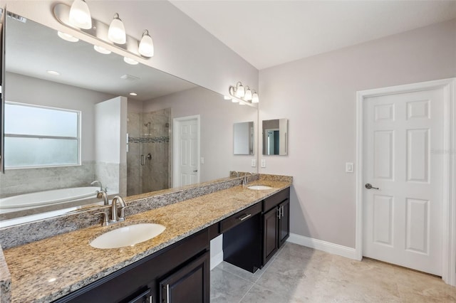 bathroom featuring independent shower and bath, vanity, and tile patterned flooring