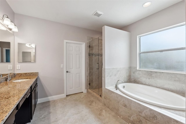 bathroom featuring vanity and plus walk in shower