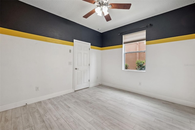 unfurnished room featuring light wood-type flooring and ceiling fan