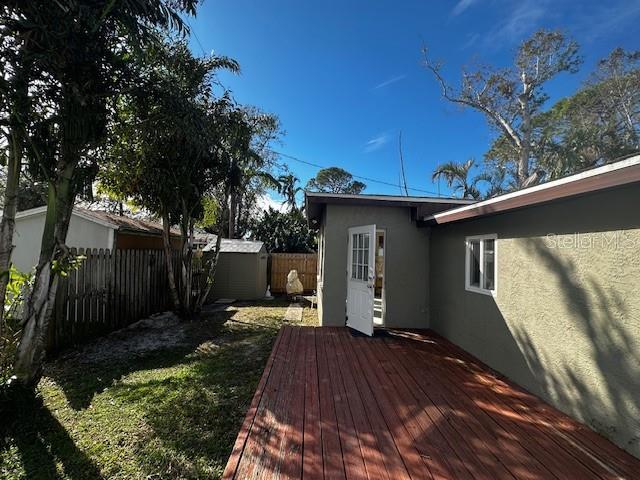 wooden deck with a storage unit