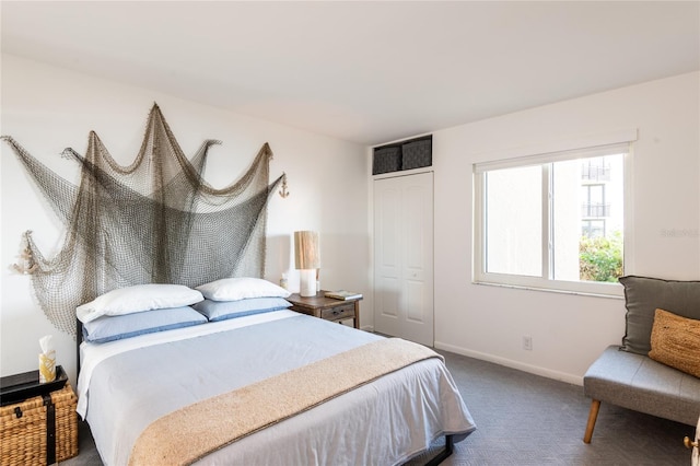 carpeted bedroom featuring a closet