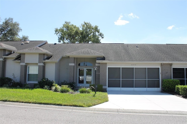 single story home featuring a garage