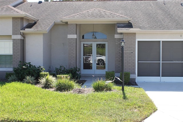 property entrance with a lawn