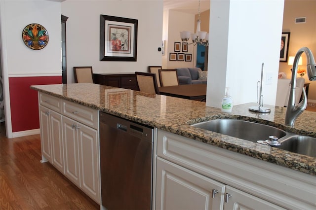 kitchen with white cabinetry, dishwasher, hardwood / wood-style flooring, and sink