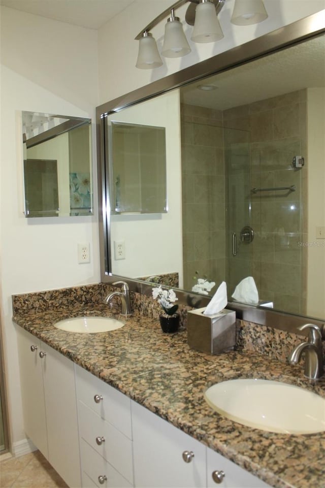 bathroom with vanity and walk in shower