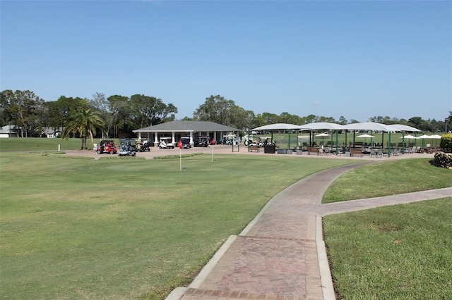 surrounding community featuring a gazebo and a lawn