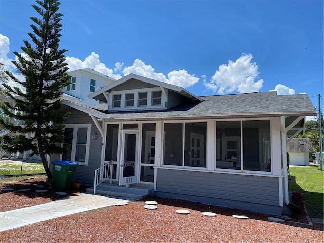 view of front facade with a sunroom