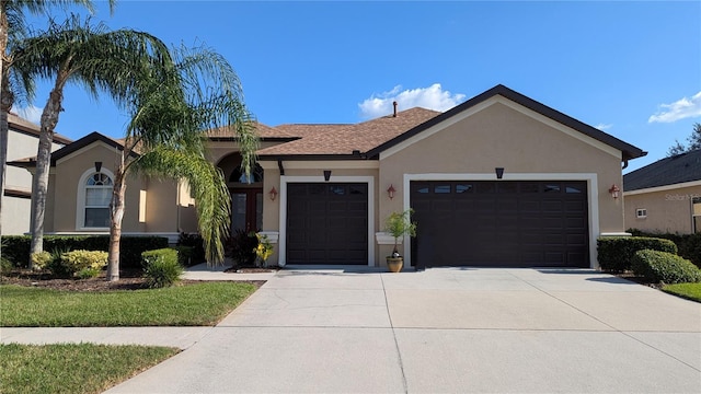 ranch-style house featuring a garage