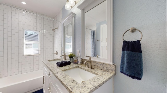 bathroom featuring vanity and shower / bath combination with curtain