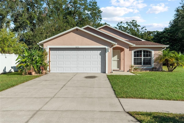 ranch-style home with a front yard and a garage