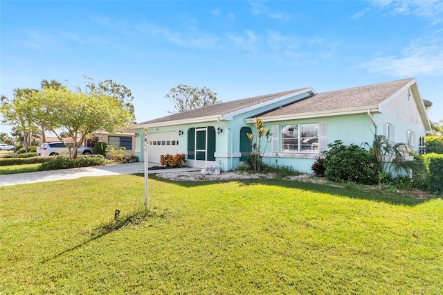 ranch-style house featuring a front yard and a garage