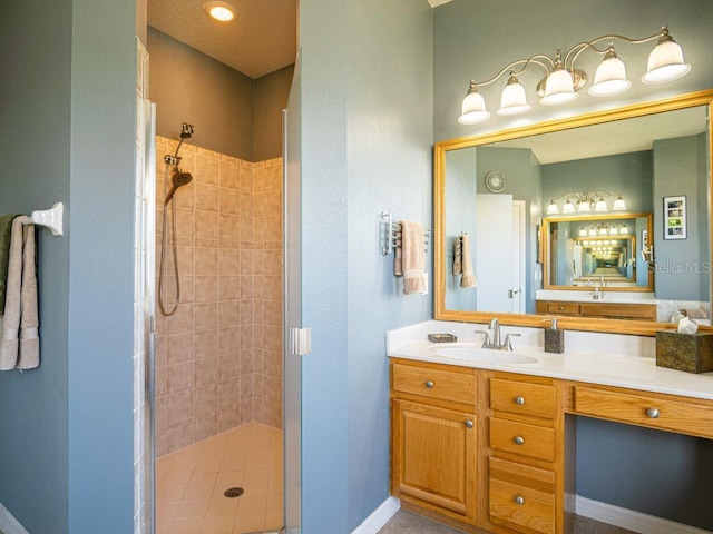 bathroom featuring tile patterned floors, vanity, and a shower with door