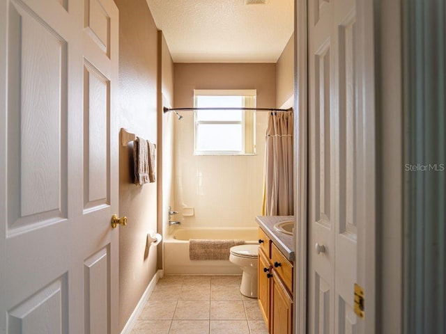 full bathroom featuring vanity, tile patterned floors, toilet, shower / bathtub combination with curtain, and a textured ceiling